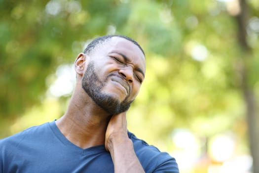 Black man complaining about neck ache