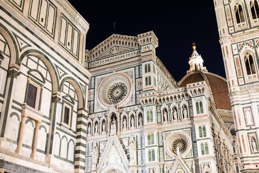Florence, Italy - Circa August 2021: Florence by night. The  illuminated architecture of the famous cathedral exterior.
