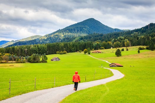 Hiking along a small gravel road near Schwangau in Bavaria, Germany