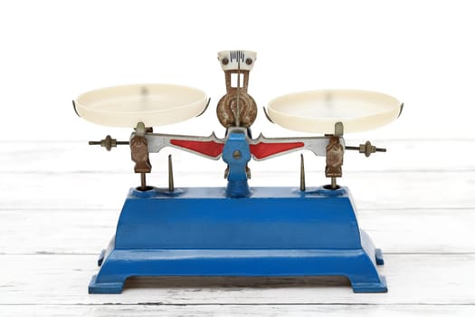 Retro roberval balance, scale on the white wooden table