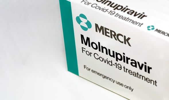 New York, USA, October 2021: Merck Covid-19 Molnupiravir treatment box isolated on a white background. Health and prevention.