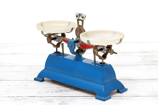 Retro roberval balance, scale on the white wooden table