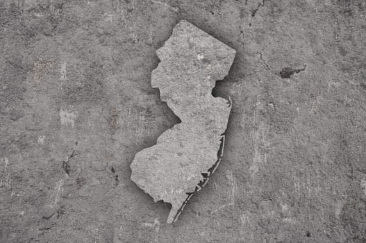 Map of New Jersey on weathered concrete