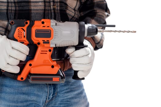 Carpenter worker at work holding rechargeable hammer drill, isolated on white background. Construction industry. Carpentry.