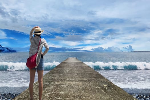 The Nice beach with blue sky with a girl lock at