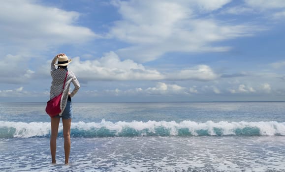 The Nice beach with blue sky with a girl lock at