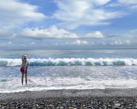 The Nice beach with blue sky with a girl lock at
