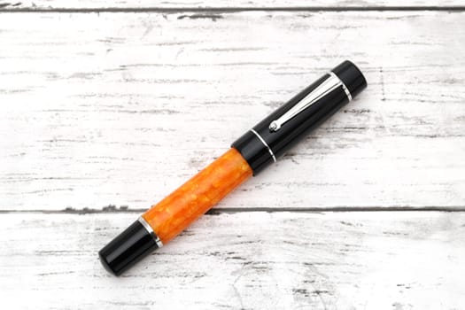 beautiful details of a fountain pen on white wooden table