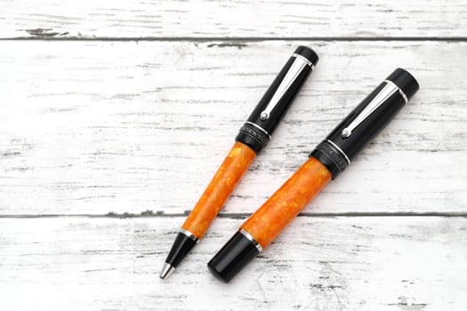 beautiful details of a fountain pen on white wooden table