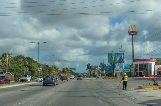 Car traffic on the Tulum-Cancun road, Quintana Roo, Mexico