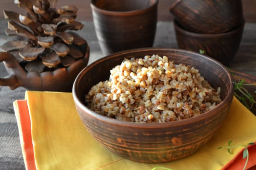 Buckwheat Porridge in rustic bowl on yellow napkin