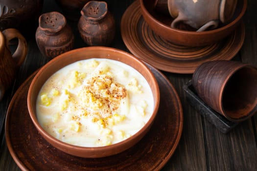 A serving of clam chowder in an old rustic bowl, traditional milk soup of Belarus