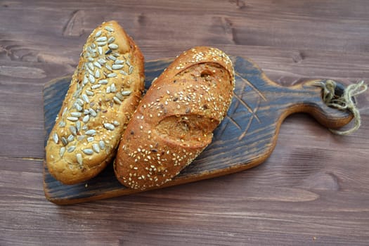 Freshly baked bread from wheat flour with sunflower seeds, pumpkin, sesame seeds