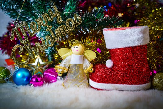 Red Santa claus boot and chrismas doll with Christmas ornaments and decorations
