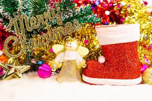 Red Santa claus boot and chrismas doll with Christmas ornaments and decorations