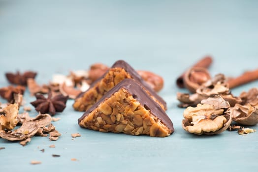Nut corner, traditional german sweets called Nussecke, covered with chocolate, christmas baking
