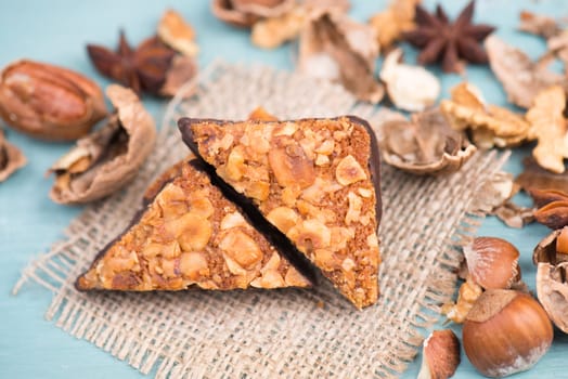 Nut corner, traditional german sweets called Nussecke, covered with chocolate, christmas baking