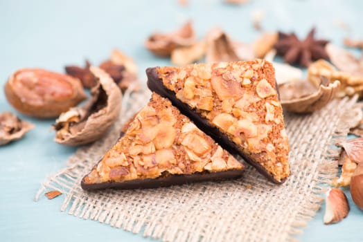Nut corner, traditional german sweets called Nussecke, covered with chocolate, christmas baking