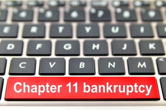Chapter 11 bankruptcy word on computer keyboard, 3D rendering