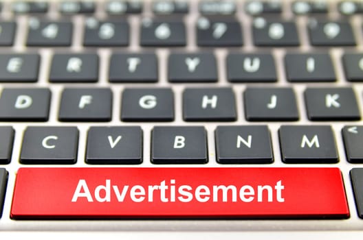 Advertisement word on computer keyboard, 3D rendering