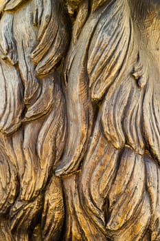 closeup front view of bronze sculpture strands of hair texture