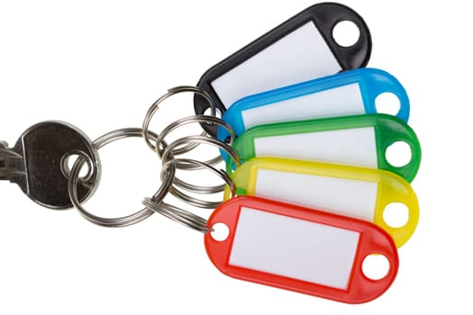 One key with five colorful tags isolated on white
