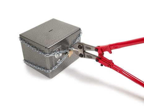 Cutting chain on safe with bolt cutters. Robbery concept.