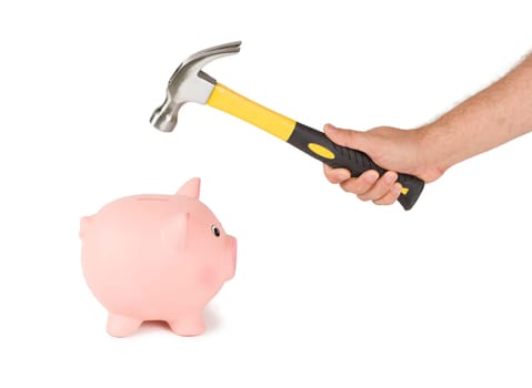 Man holding a hammer and biggy bank. Breaking savings concept.