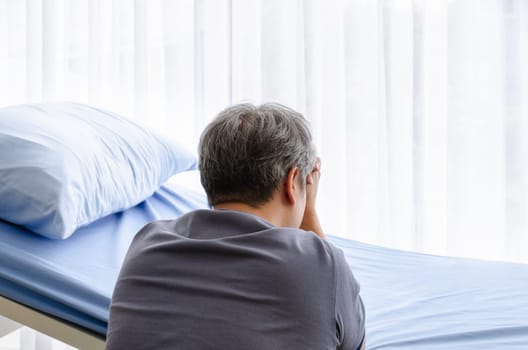 Elderly man feel grief suffer on patient bed for gone wife in hospital