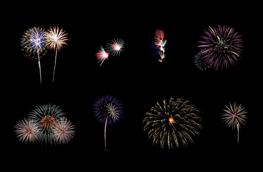 Collection of colorful festive eight fireworks exploding over night sky, isolated on black background