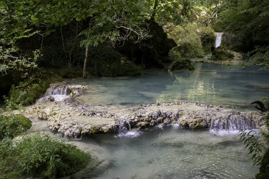 Detail of crystal clear spring water in a wild forest, nature