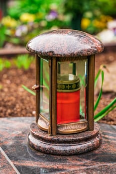 memorial candles light on grave