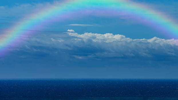 Beautiful sea with a rainbow in the sky