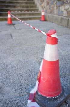 Security area marked by cones and tape. Selective focus
