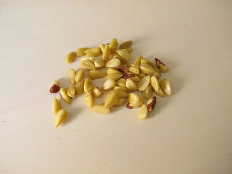 Shelled beechnuts without hull on a wooden board