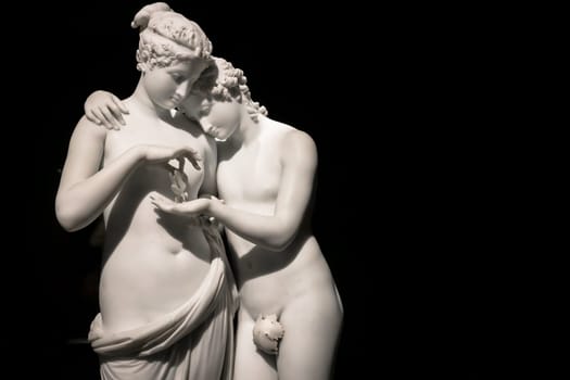 MILAN, ITALY - June 2020. Antonio Canova's masterpiece Cupid and Psyche (Amore e psiche, 1797), symbol of eternal love. Psyche raises Cupid left hand with her own, to place a butterfly on his palm. The butterfly symbolizes her soul, which she offers in all innocence to Cupid.