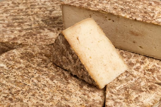 Food as a background - mounatin cheese named tome