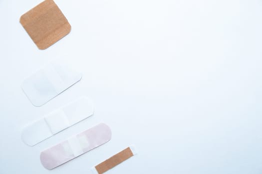 Bactericidal patches of various shapes and sizes lie on a white background with a place for text. High quality photo