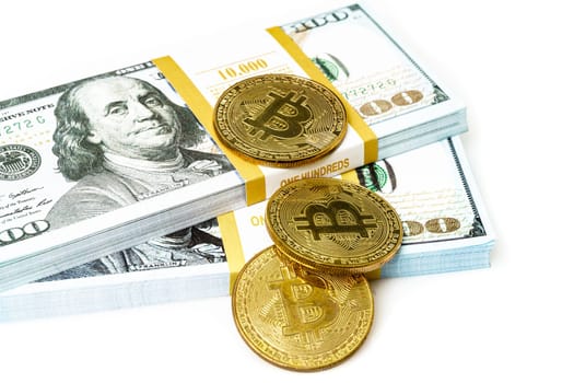 coins of bitcoin with heap of dollar bill on white. Business concept