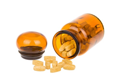 Full vintage apothecary bottle with pills and open lid and spilled pills isolated on white background