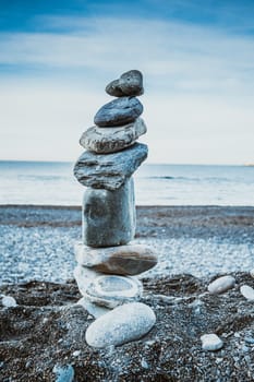 Stack of balanced stones on the beach