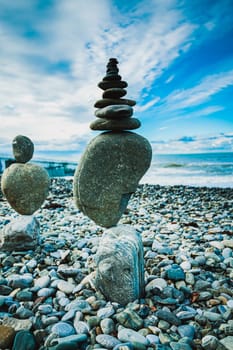 Stack of balanced stones on the beach