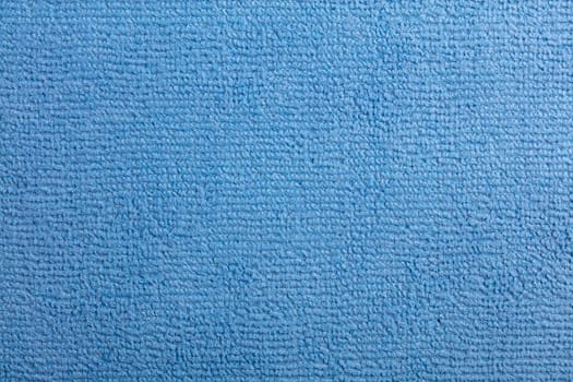 Microfiber Towel Blue Terry Texture Wrist Watch. Microfiber cloth with close-up. Fabric structure background. Fabric blue pattern. Cleaning service. Macro object.