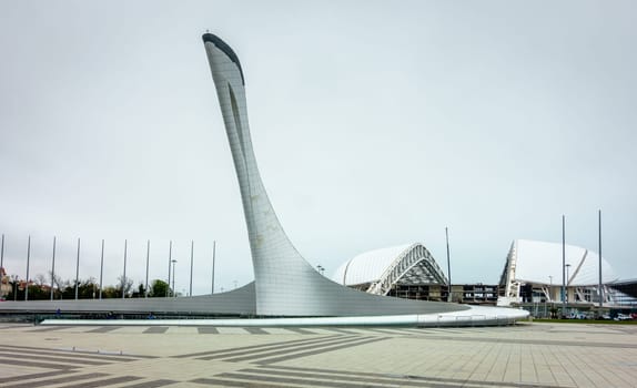 sochi, Adler, Russia, April 14, 2016: View of Olympic Torch Monument and stadium Fisht in Olympic Park in Sochi after the Winter Olympics of 2015