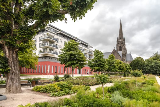 Beautiful public Park with roses and Dankeskirche in Bad Nauheim, Germany