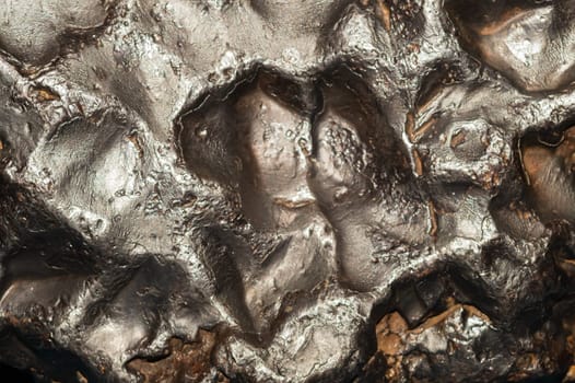 Meteorite texture background. meteorite surface close up. stone backdrop