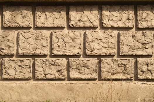 Old brick wall background. wall from squared bricks. cracked stone wall texture