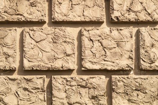 Old brick wall background. wall from squared bricks. cracked stone wall texture