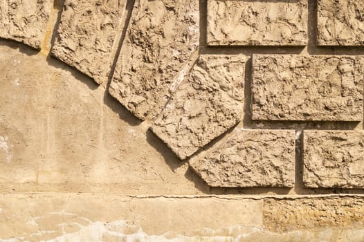 Old brick wall background with copy space. wall from squared bricks. cracked stone wall texture