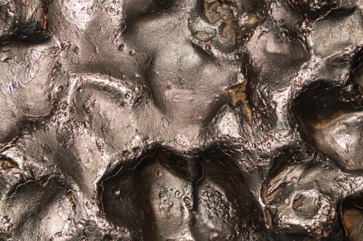 Meteorite texture background. meteorite surface close up. stone backdrop